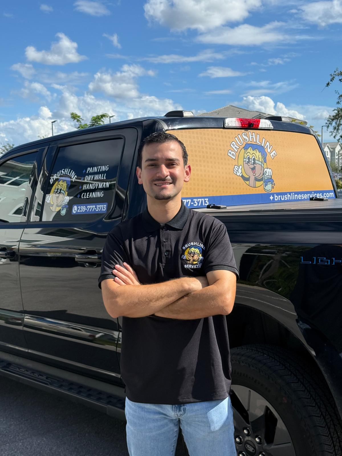 Brushline Services owner beside the company truck